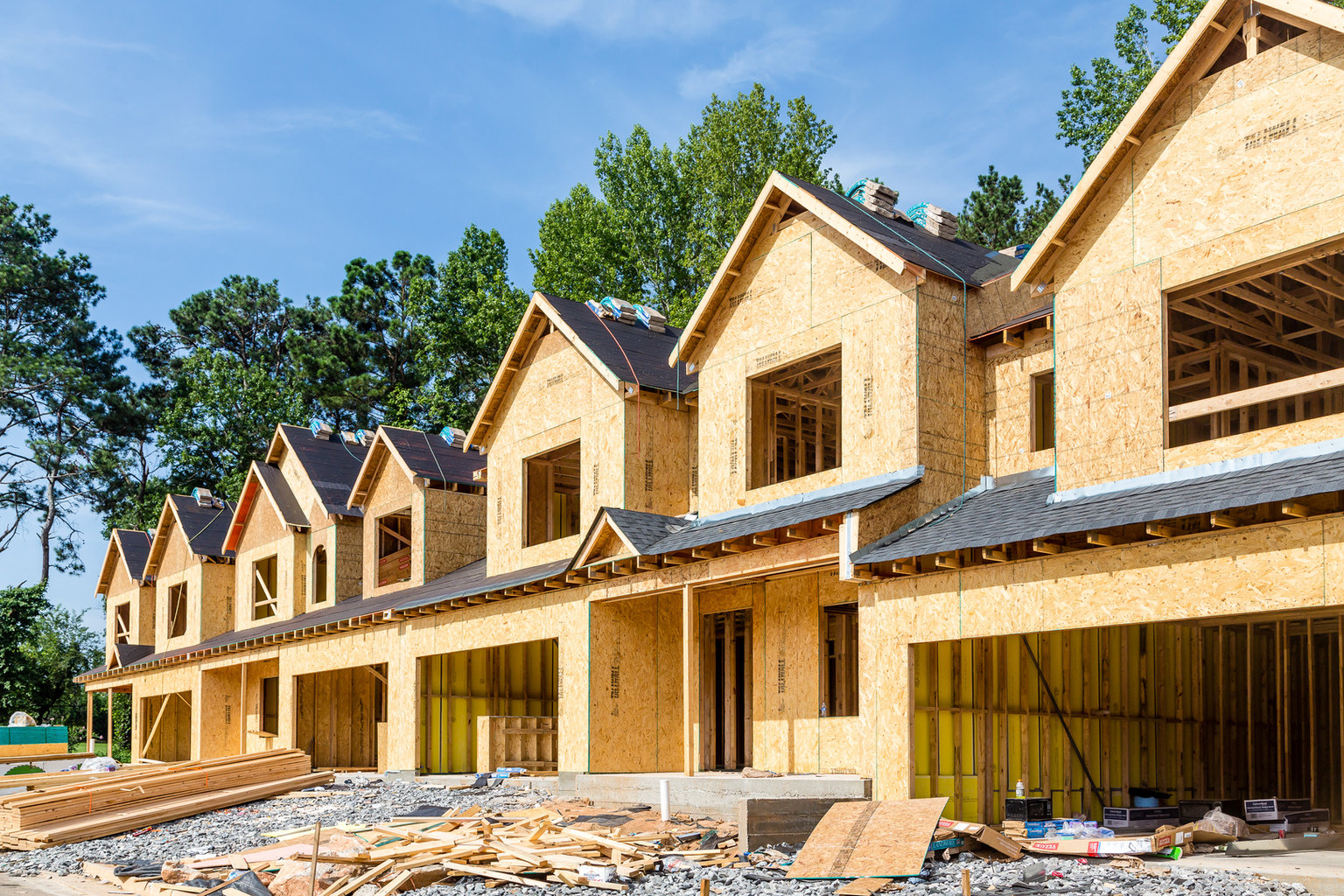 New homes under construction with exposed wood framing